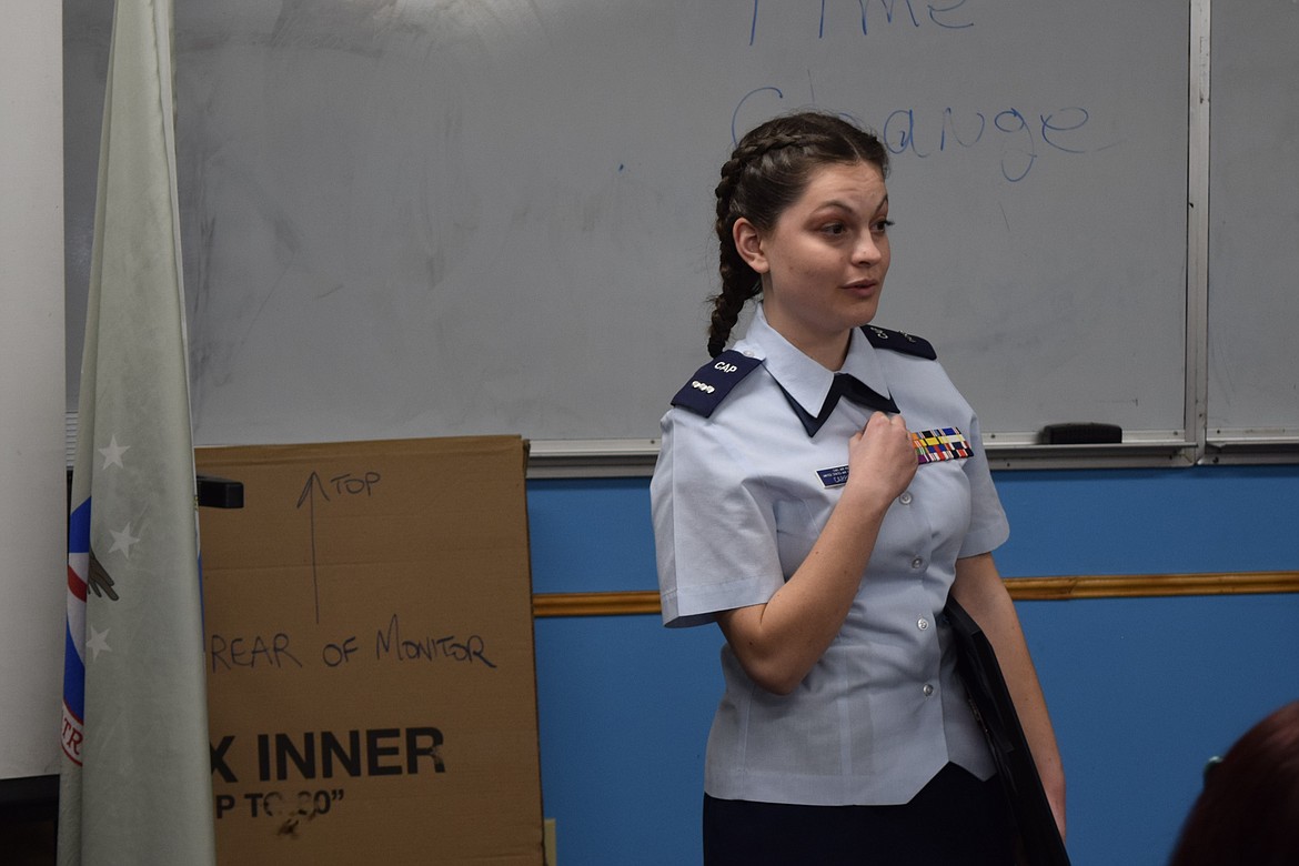 Civil Air Patrol Columbia Basin Composite Squadron member Daisy Carpenter speaks during the ceremony for her promotion from cadet first lieutenant to cadet captain Thursday in Ephrata at Camp Boucher.