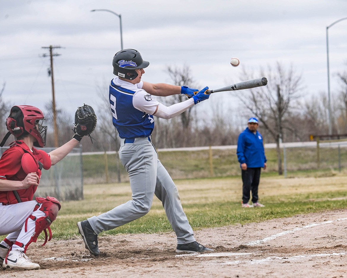 Mission-Arlee's Milo Crooks slams the ball during last Saturday's game against Noxon. (Christa Umphrey photo)