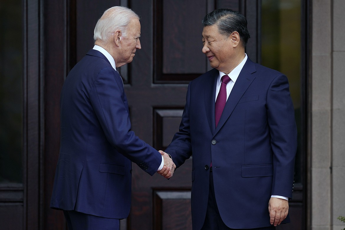 President Joe Biden greets China's President President Xi Jinping at the Filoli Estate in Woodside, Calif., Nov, 15, 2023, on the sidelines of the Asia-Pacific Economic Cooperative conference. Biden and Xi spoke Tuesday in their first call since their November summit in California, Chinese state media reported. (Doug Mills/The New York Times via AP, Pool, File)