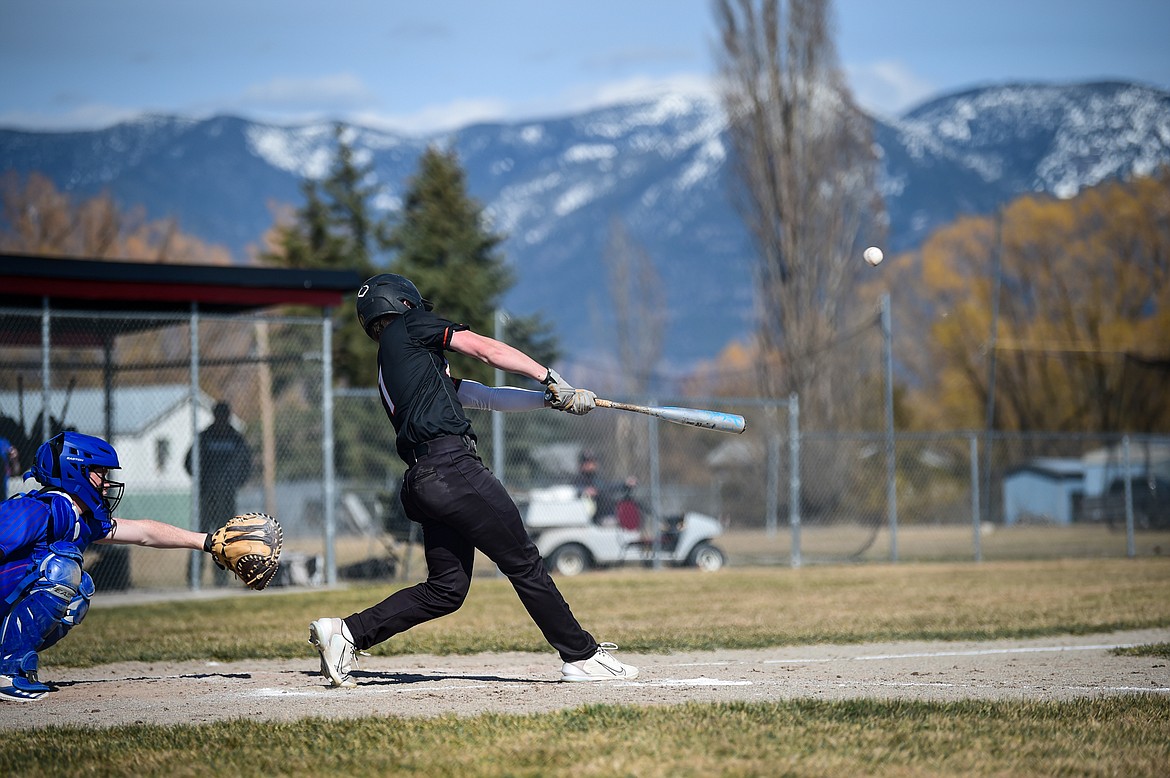 Eureka's Tristan Libby (1) drives in a run in the third inning against Bigfork at ABS Field in Evergreen on Tuesday, April 2. (Casey Kreider/Daily Inter Lake)