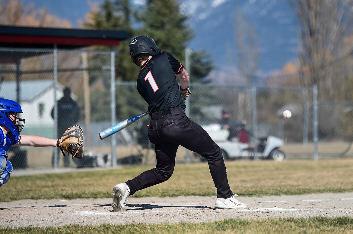 Eureka's Tristan Libby (1) drives in a run in the third inning against Bigfork at ABS Field in Evergreen on Tuesday, April 2. (Casey Kreider/Daily Inter Lake)