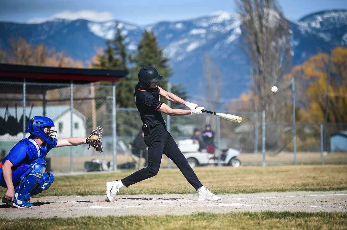 Eureka's AJ Truman (7) connects in the fourth inning against Bigfork at ABS Park in Evergreen on Tuesday, April 2. (Casey Kreider/Daily Inter Lake)