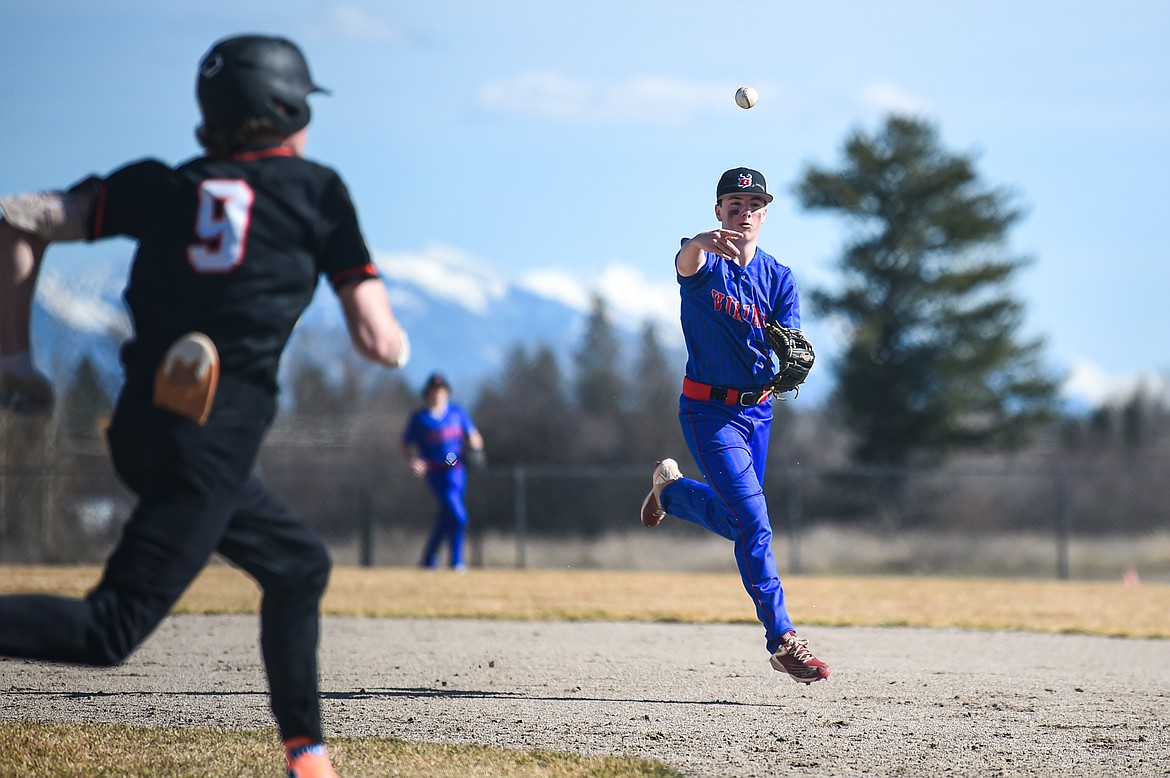 Bigfork second baseman Mason Lewis (22) throws to first for an out after fielding a grounder hit by Eureka's Tristan Butts in the fourth inning at ABS Park in Evergreen on Tuesday, April 2. (Casey Kreider/Daily Inter Lake)