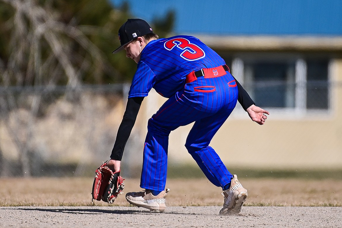 Bigfork shortstop Grady Campbell (3) backhands a grounder and throws across the diamond to first for the out in the fifth inning against Eureka at ABS Park in Evergreen on Tuesday, April 2. (Casey Kreider/Daily Inter Lake)