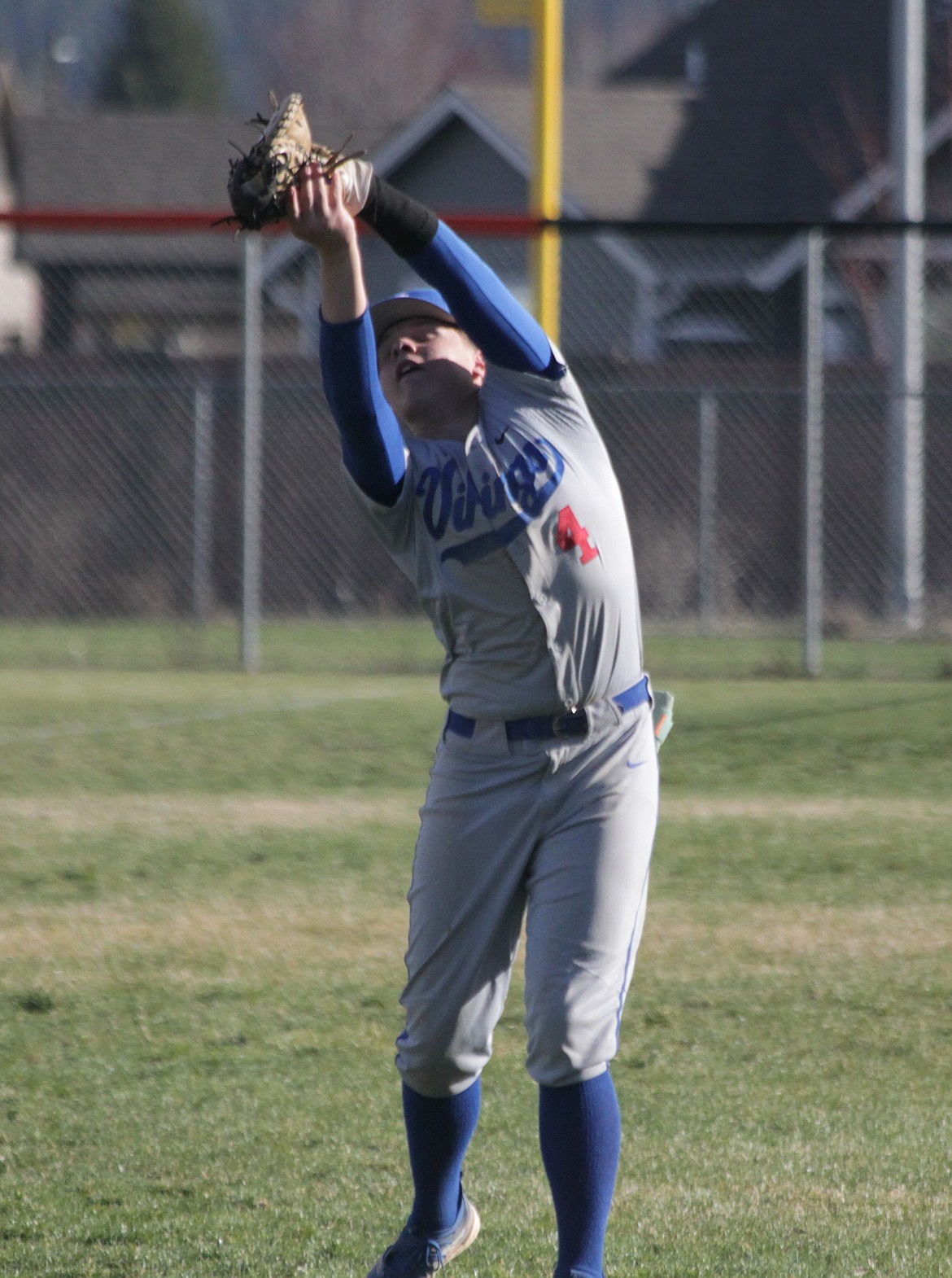 MARK NELKE/Press
Coeur d'Alene first baseman Gavin Helms snares a popup in foul territory in the first game against Post Falls on Tuesday at Post Falls High.