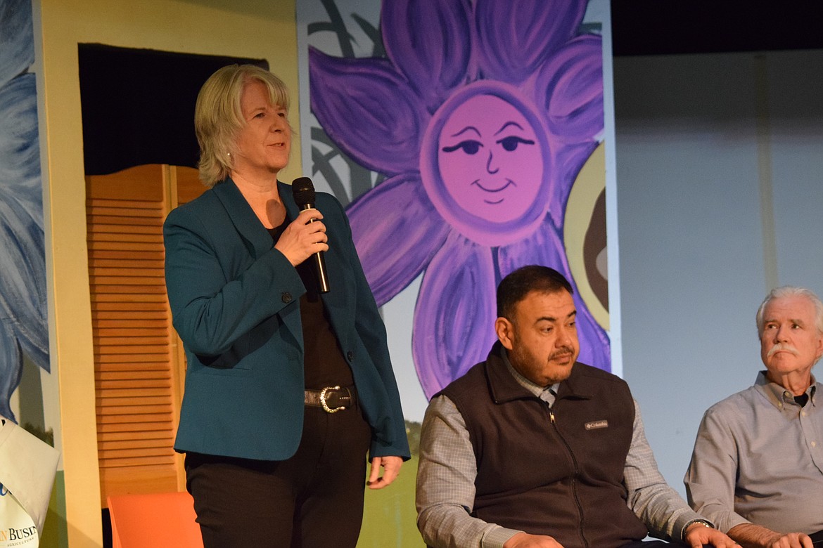 Ephrata City Council Member and Ephrata Chamber of Commerce Board Member Valli Millard speaks during the We Are Ephrata Town Hall on March 28 while Columbia Basin Hospital Director of Facilities Javier Meraz and Port of Ephrata Executive Director David Lanman listen.