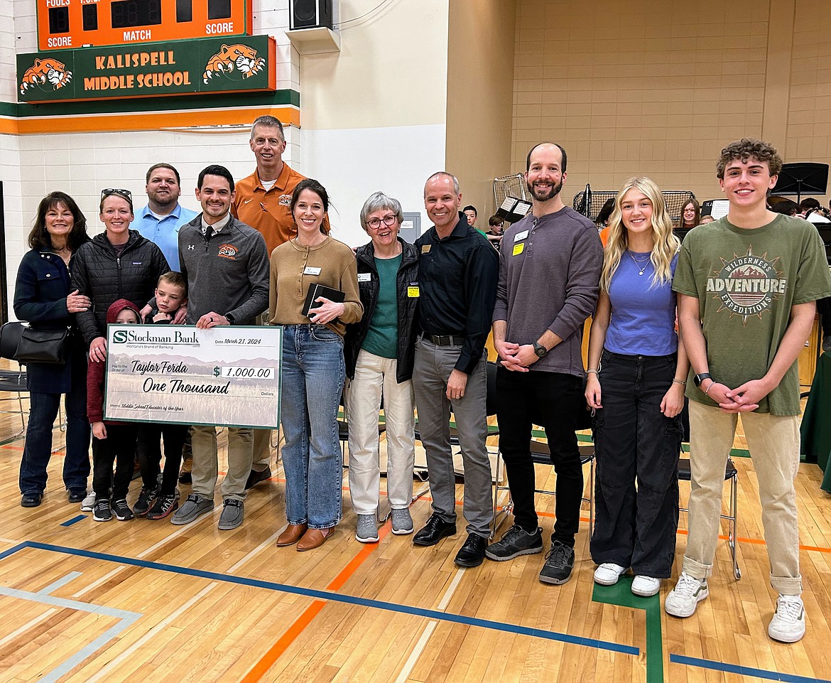 The Kalispell Education Foundation awards Kalispell Middle School social studies teacher and department head Taylor Ferda with the Middle School Educator Teacher of the Year award. As part of the award, Ferda received $1,000 to use for his classroom. (Courtesy photo)