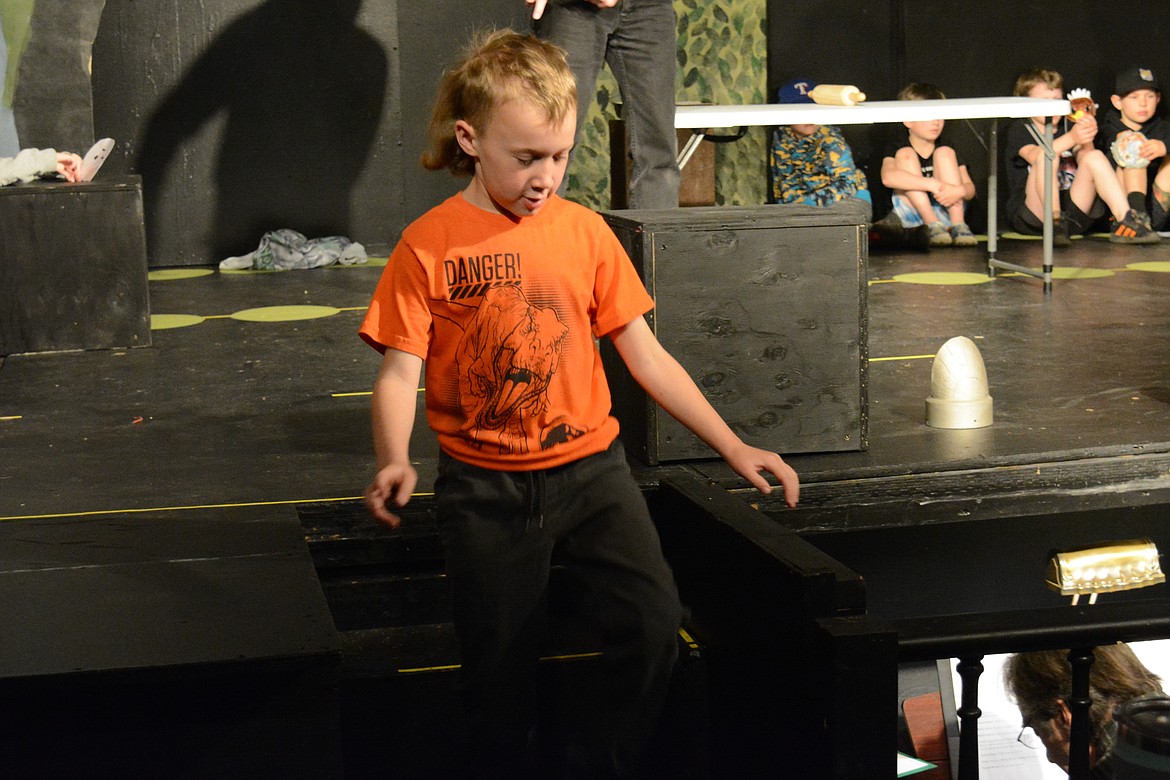 Joben Robb from Canyon Elementary School sprints around the theater as the gingerbread man at the Sixth Street Melodrama and Theater.