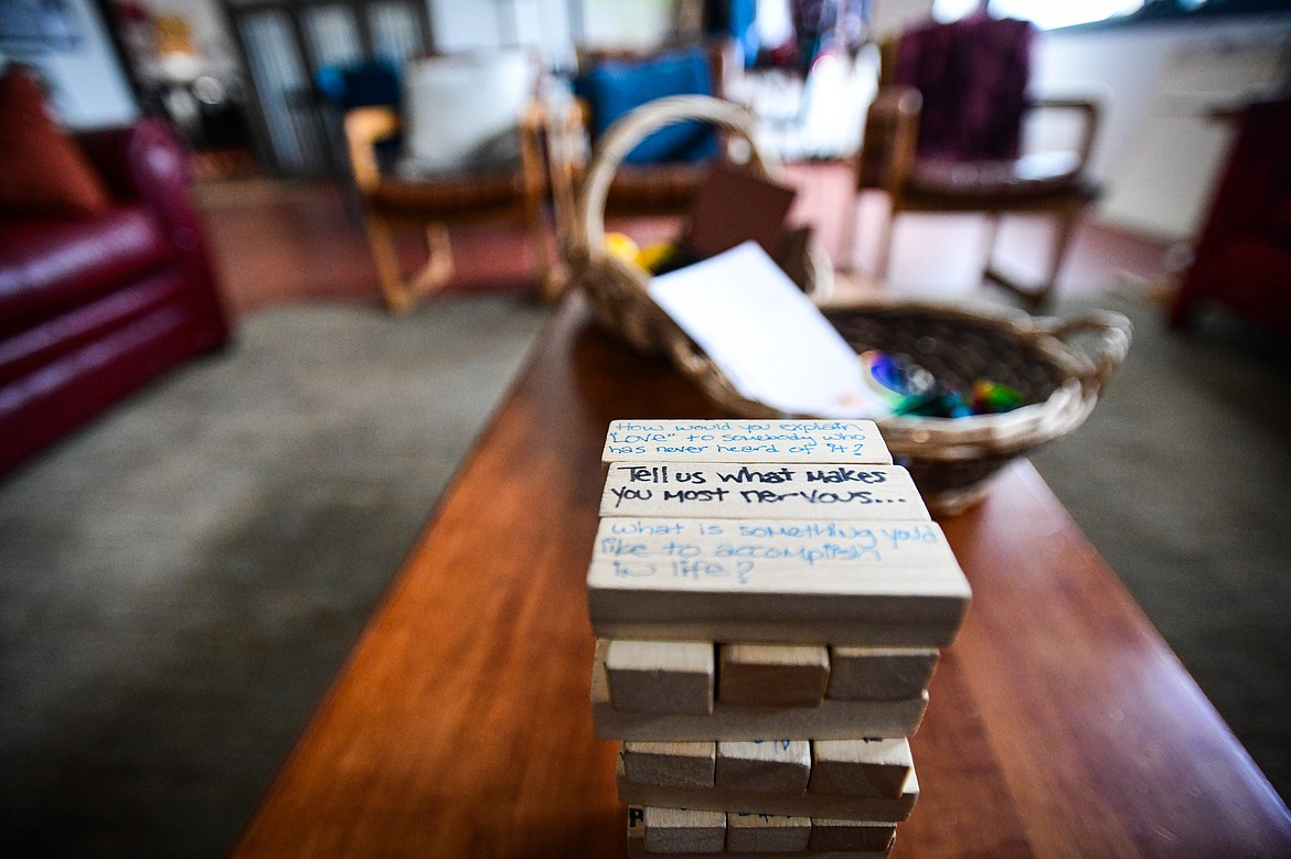 Jenga blocks with handwritten questions on them to help facilitate discussions at the Center for Restorative Youth Justice in Kalispell on Wednesday, April 3. (Casey Kreider/Daily Inter Lake)