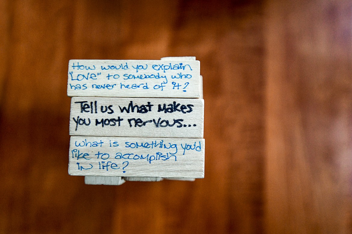 Jenga blocks with handwritten questions on them to help facilitate discussions at the Center for Restorative Youth Justice in Kalispell on Wednesday, April 3. (Casey Kreider/Daily Inter Lake)