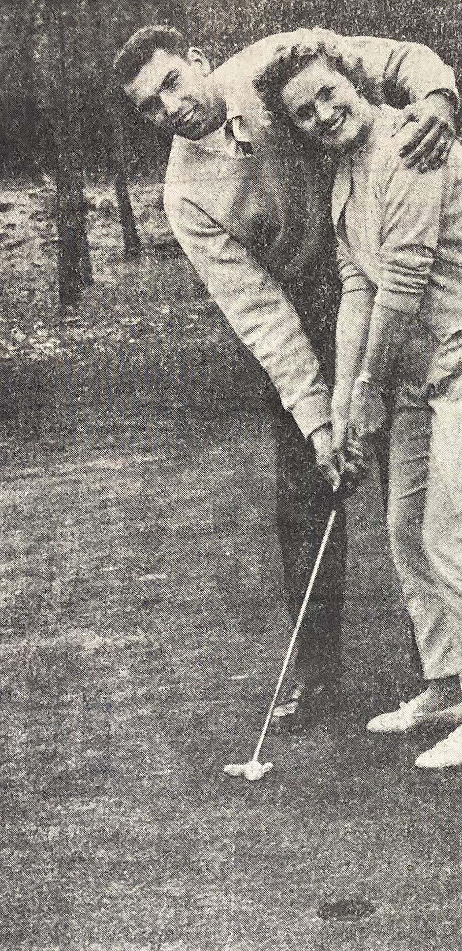 Coeur d’Alene Golf Course pro John Woodhall shows wife, Valleda, how to golf.