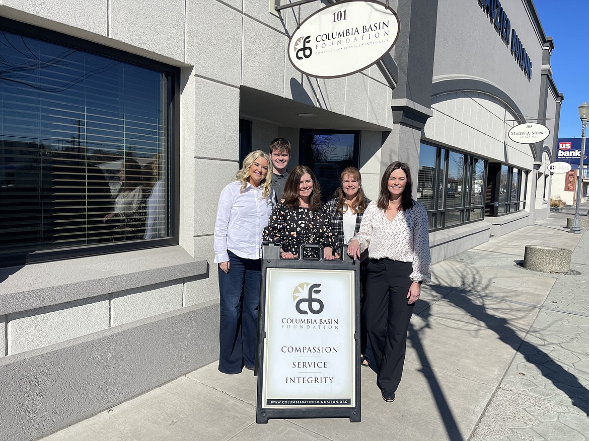 Columbia Basin Foundation staff stop for a portrait in front of their offices in downtown Ephrata. The nonprofit works to help local donors manage funds intended to build up communities in the Columbia Basin.