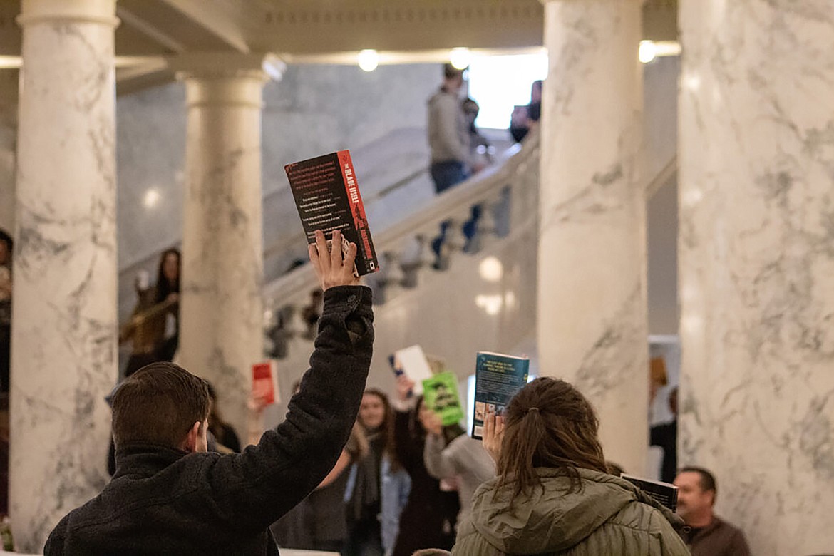 Attendees hold books in support of Idaho libraries at the “Idaho Freedom to Read-in” event held at the Idaho Capitol Building on Jan. 13, 2024. The event was organized by the Idaho Library Association, alongside the Meridian Library Alliance, the North Central Idaho Alliance, the Community Library Network Alliance, and Rediscovered Books.