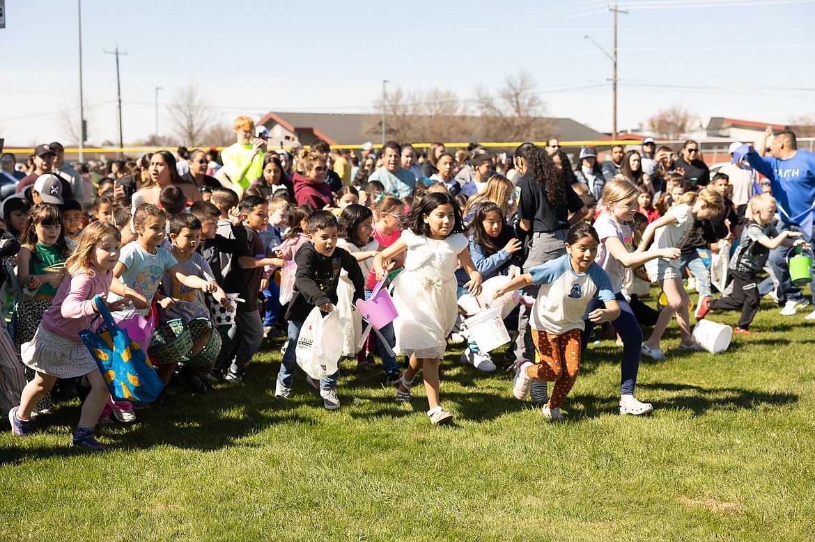 Children begin hunting for eggs at Lions Park during Saturday’s Othello Egg Hunt. Othello Holiday Committee Manager Tania Morelos said the event was over in less than a minute.