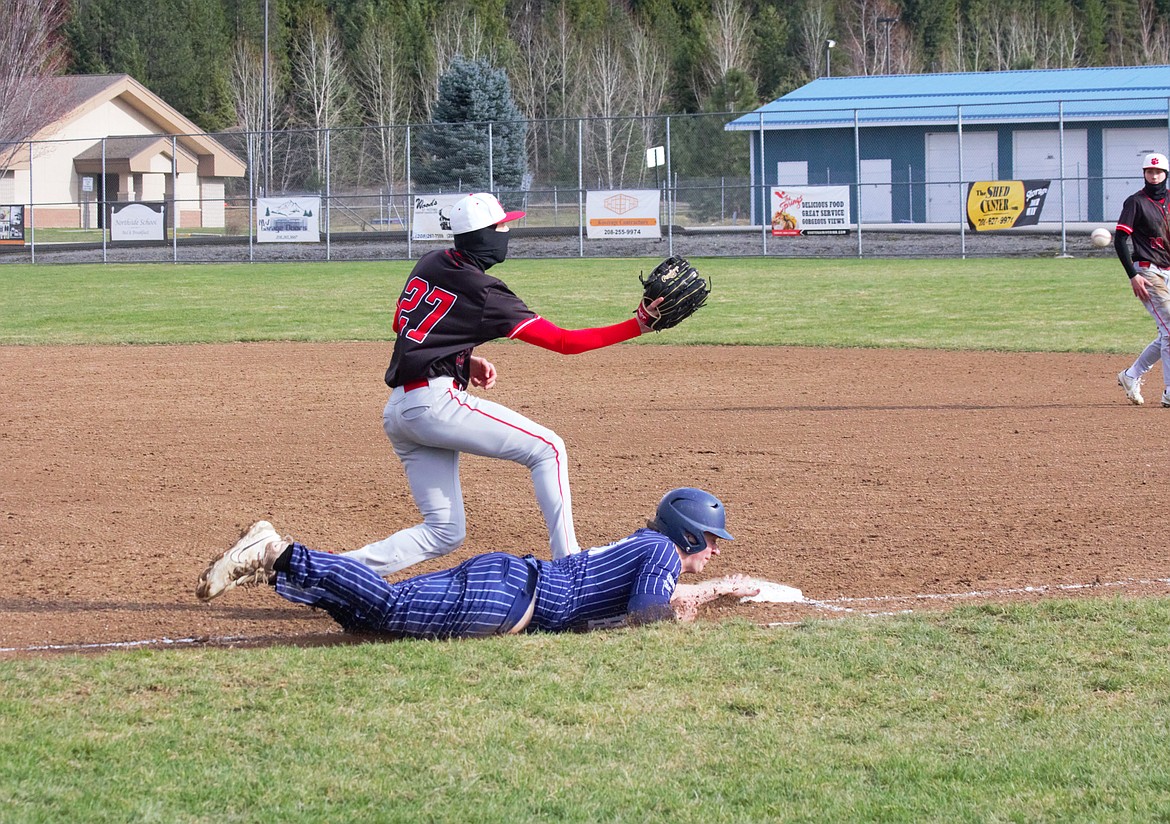 Trey Bateman is safe at first base against Sandpoint on March 29.