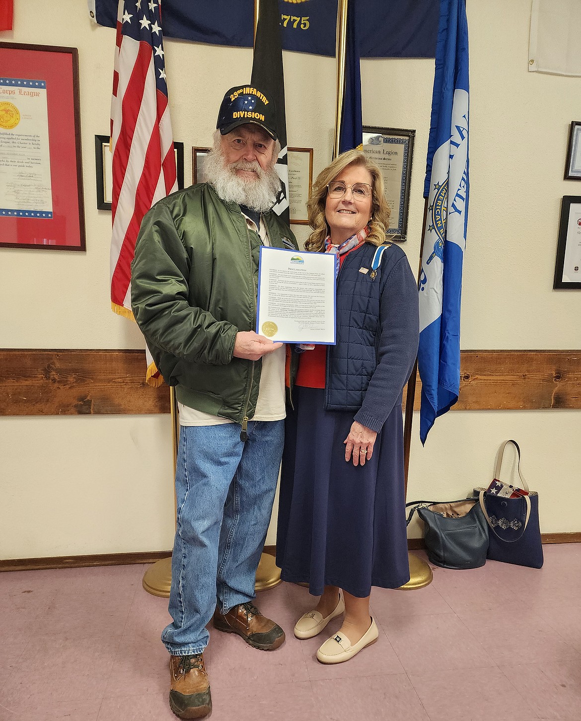 Jeff Dunnum, president of Vietnam Veterans Chapter 890 in Sandpoint, accepts a proclamation from the city of Sandpoint honor local Vietnam veterans from Susan Costa, regent of the Wild Horse Trail Chapter. DAR members recently held a luncheon to honor local veterans.