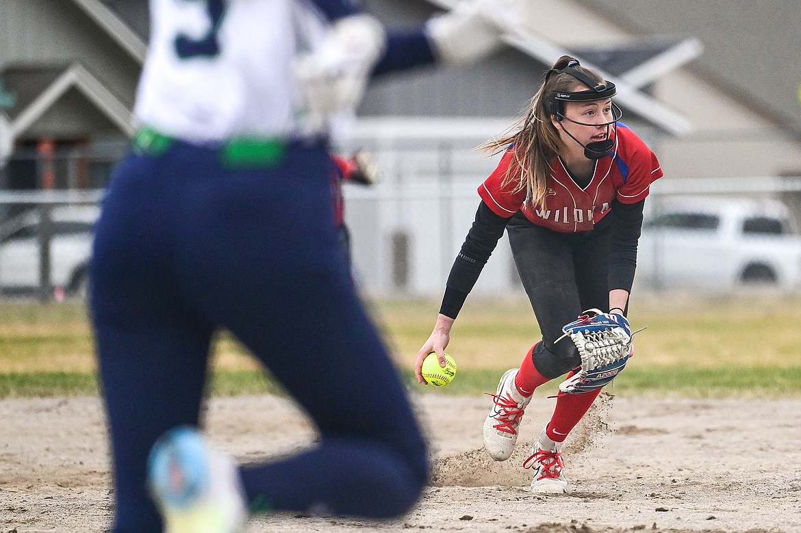 Columbia Falls second baseman Addy Bowler (11) underhands to first for an out against Glacier at Columbia Falls High School on Friday, April 5. (Casey Kreider/Daily Inter Lake)