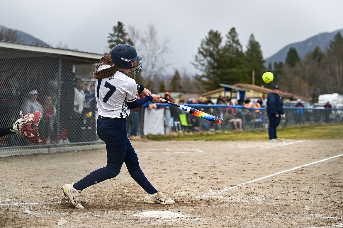 Glacier's Karley Allen (17) connects on an RBI single in the fifth inning against Columbia Falls at Columbia Falls High School on Friday, April 5. (Casey Kreider/Daily Inter Lake)