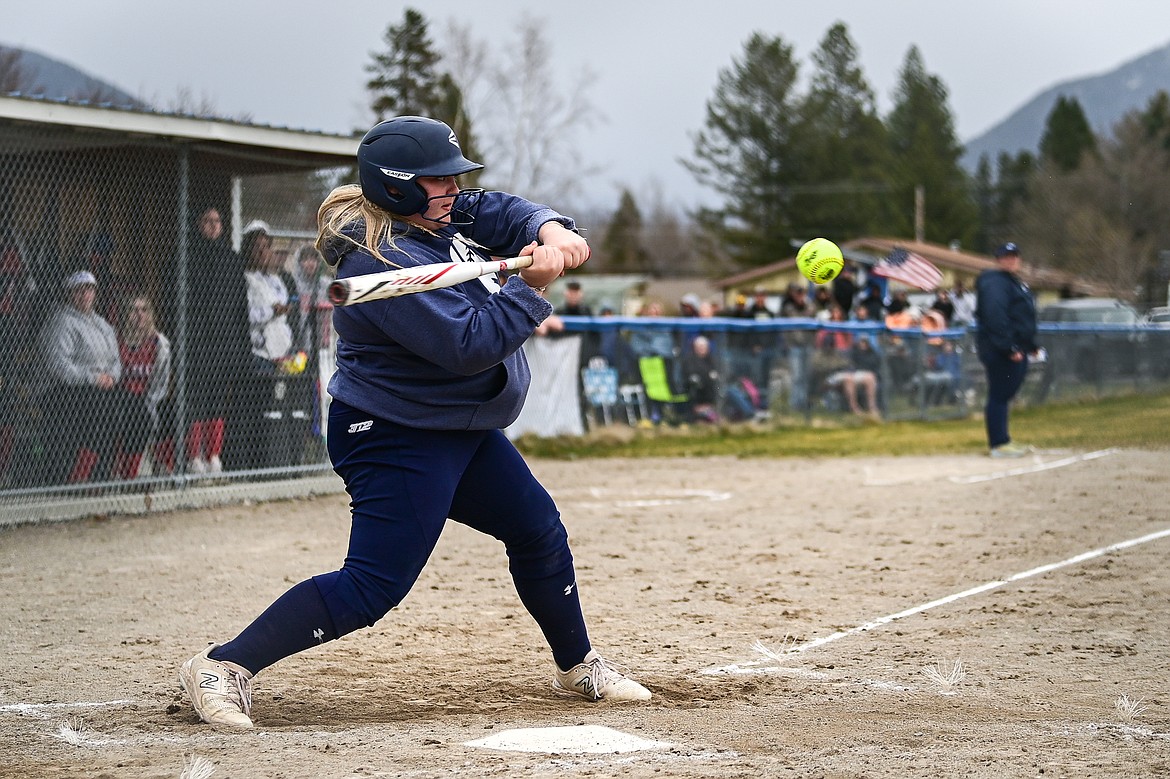 Glacier's Paishance Haller (27) connects on an RBI single in the fifth inning against Columbia Falls at Columbia Falls High School on Friday, April 5. (Casey Kreider/Daily Inter Lake)