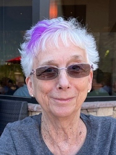 Mardi Carroll was known for her streak of purple hair and the love she provided to those around her.