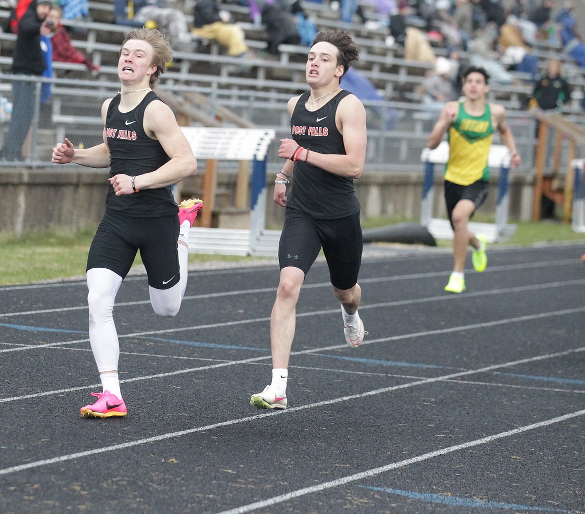 JASON ELLIOTT/Press
Post Falls junior Trenton McLean beats teammate Tallan McCracken to the finish line in the boys 400-meter dash at the Kootenai County Challenge on Friday at Timberlake High.