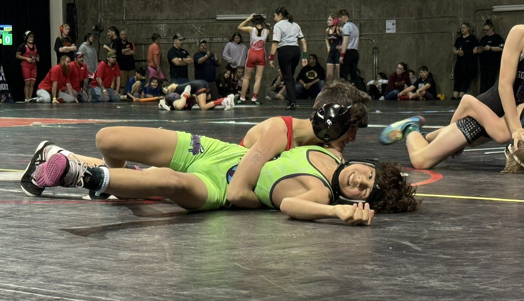 Timmy Stark pins an opponent on Saturday. Stark won all three of his matches by pin en route to a gold medal.