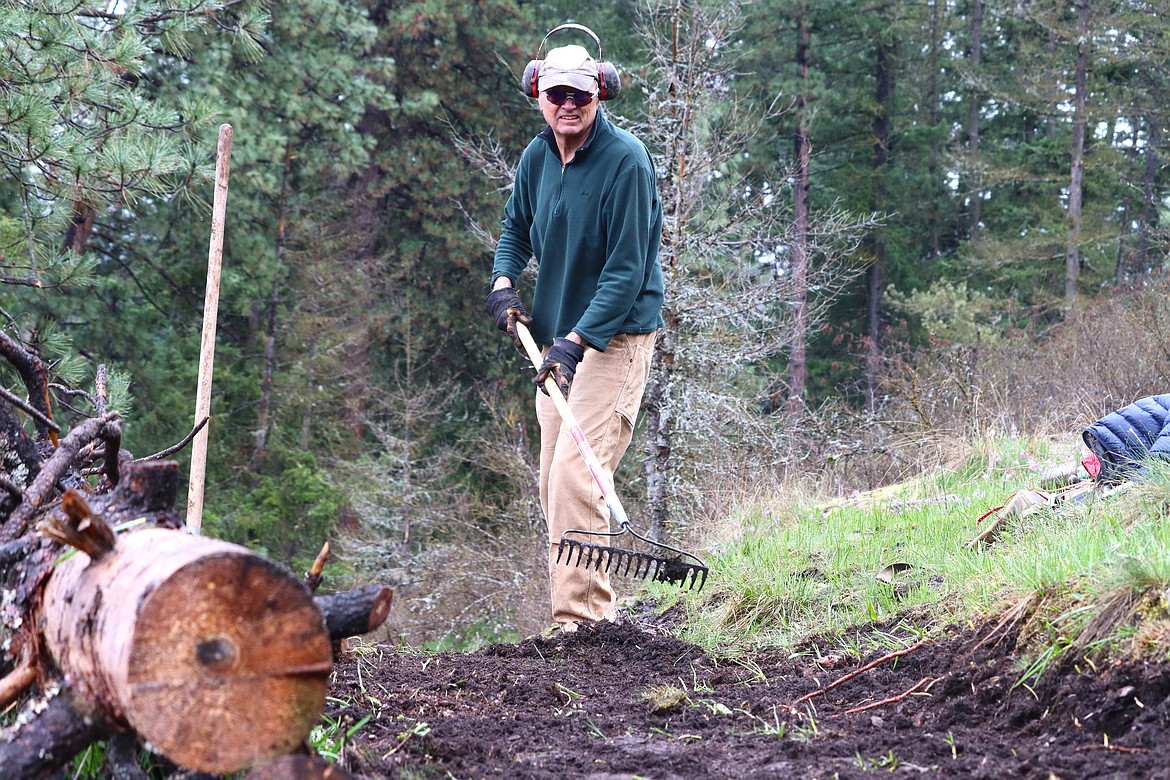 Dave Yadon works on trail improvements on Tubbs Hill on Friday.