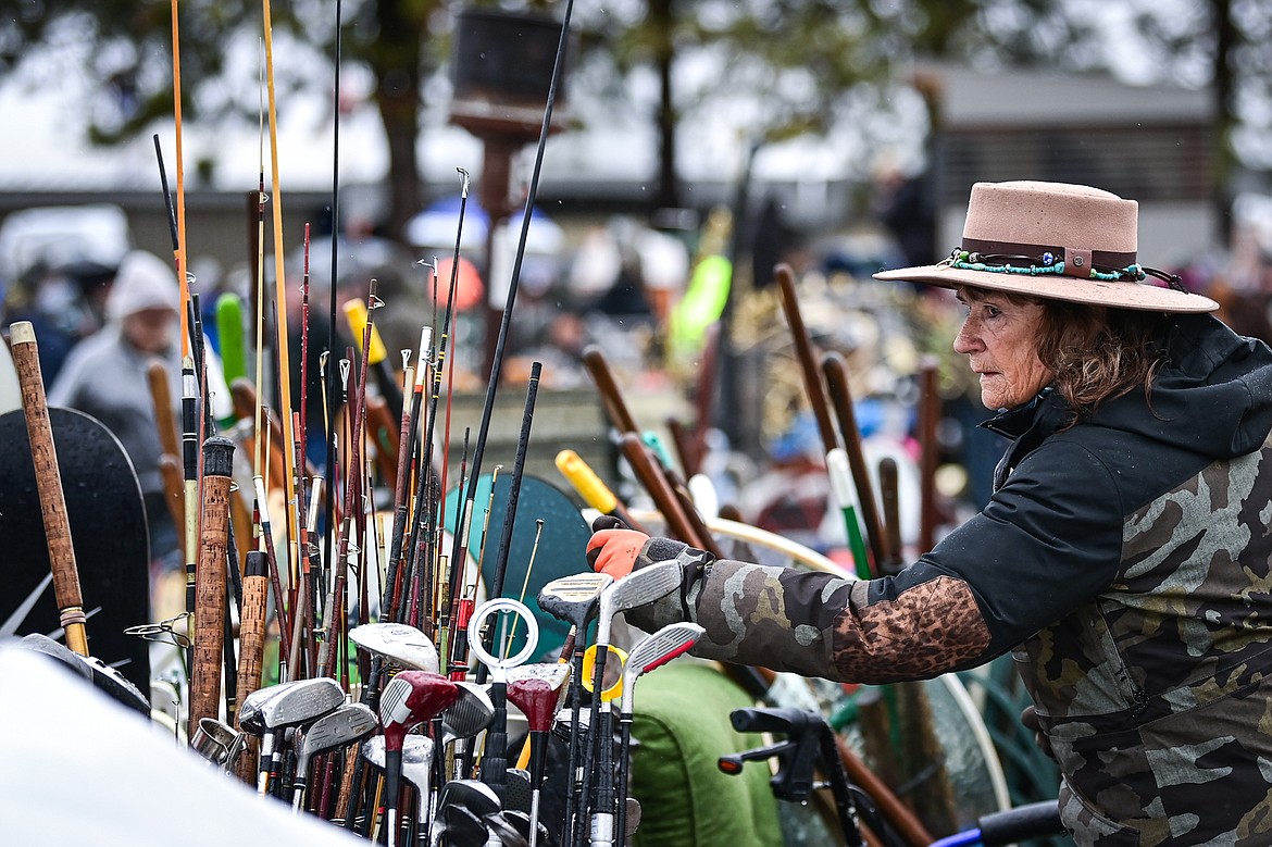 Kathleen Bell looks through items at the 58th annual Creston Auction and Country Fair on Saturday, April 6. The event is the largest fundraiser for the Creston Fire Department and has been held since 1966. (Casey Kreider/Daily Inter Lake)