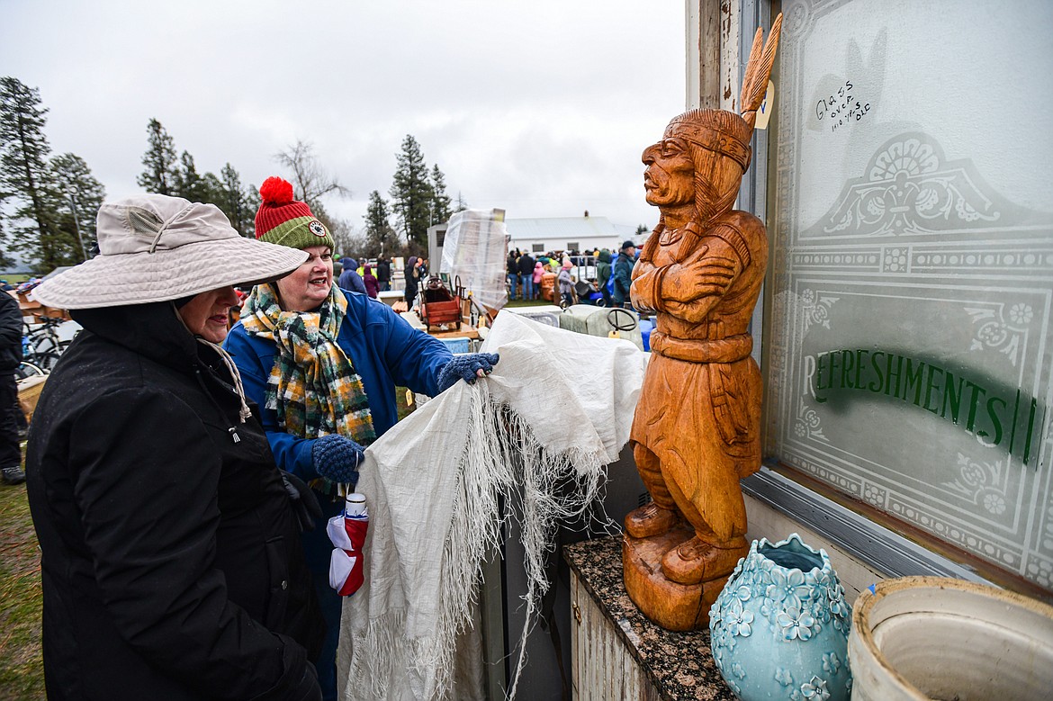 Visitors check out items up for sale at the 58th annual Creston Auction and Country Fair on Saturday, April 6. The event is the largest fundraiser for the Creston Fire Department and has been held since 1966. (Casey Kreider/Daily Inter Lake)