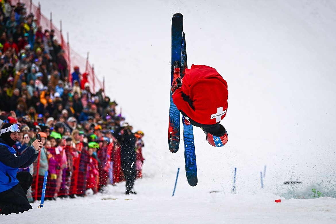 Anders Soyland lands a front flip out of the pool after a successful trip across the water at the pond skim at Whitefish Mountain Resort on Saturday, April 6. (Casey Kreider/Daily Inter Lake)