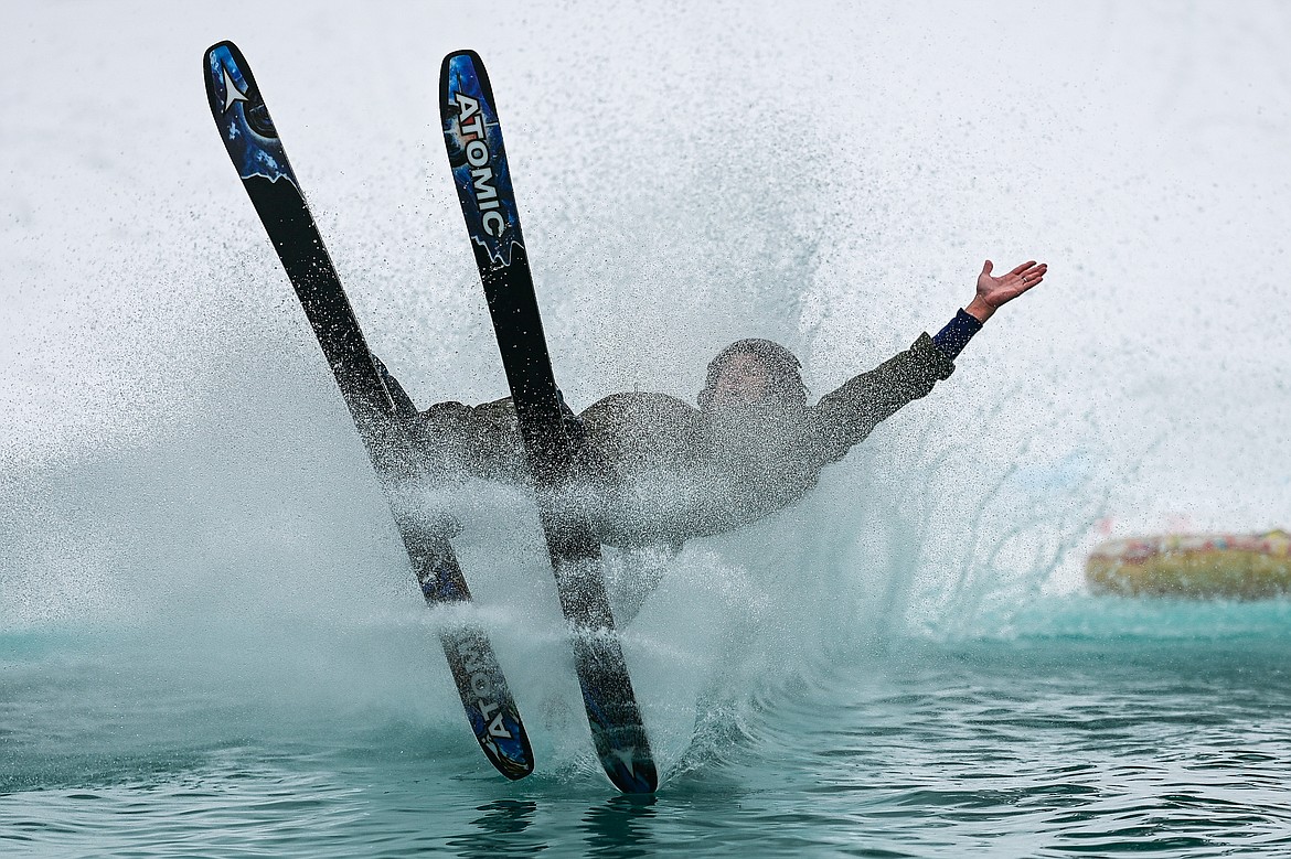 A participant crashes during the pond skim at Whitefish Mountain Resort on Saturday, April 6. (Casey Kreider/Daily Inter Lake)