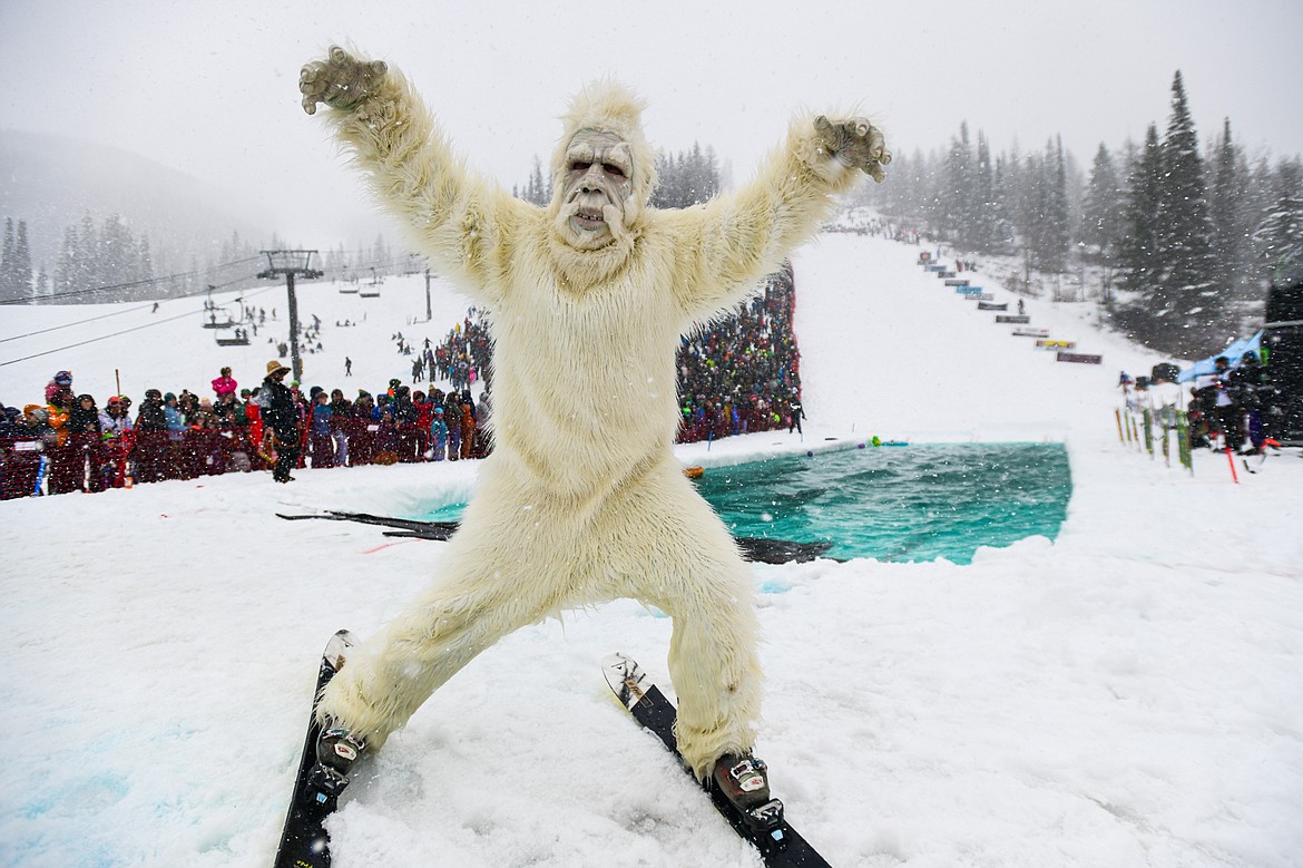 A participant celebrates after a successful trip across the water at the pond skim at Whitefish Mountain Resort on Saturday, April 6. (Casey Kreider/Daily Inter Lake)