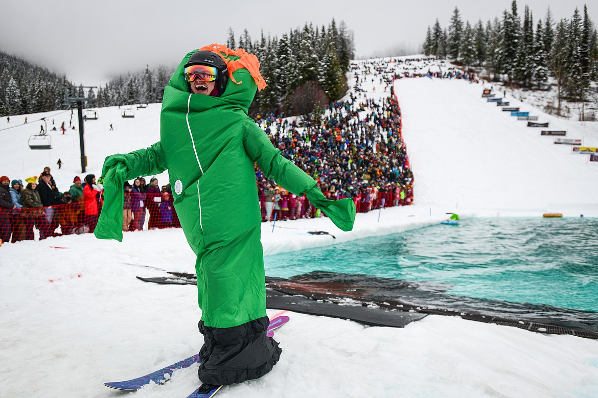 A participant completes a trip across the water during the pond skim at Whitefish Mountain Resort on Saturday, April 6. (Casey Kreider/Daily Inter Lake)