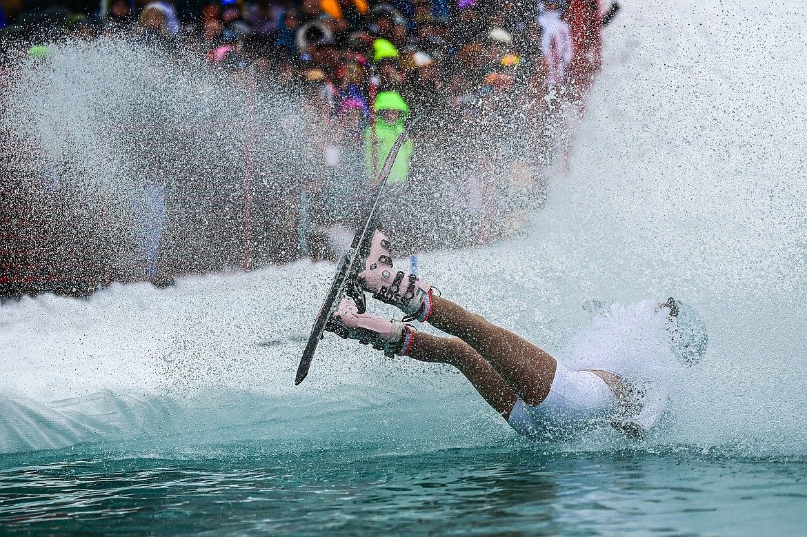 A participant crashes during the pond skim at Whitefish Mountain Resort on Saturday, April 6. (Casey Kreider/Daily Inter Lake)