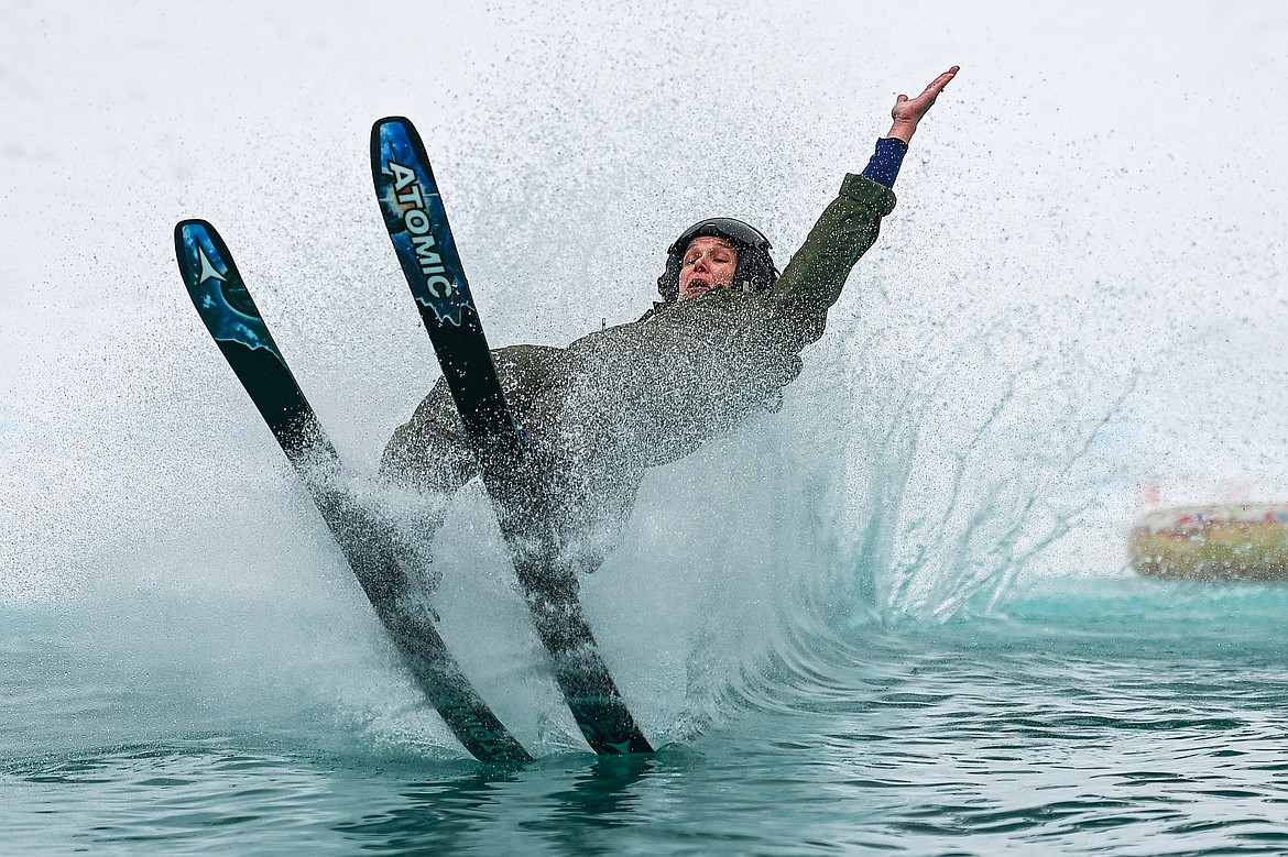 A participant crashes during the pond skim at Whitefish Mountain Resort on Saturday, April 6. (Casey Kreider/Daily Inter Lake)