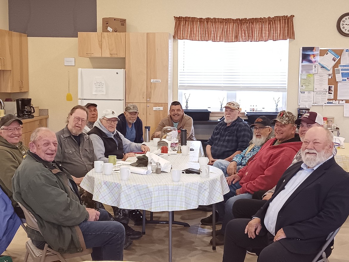 Rich Minson, head of the table far back, is the St. Regis School maintenance supervisor and employee of the month of March. He joins his friends at the St. Regis Senior Citizens Center on the weekends where everyone is invited to meet and jaw seven days a week at 9 a.m. (Monte Turner/Mineral Independent)