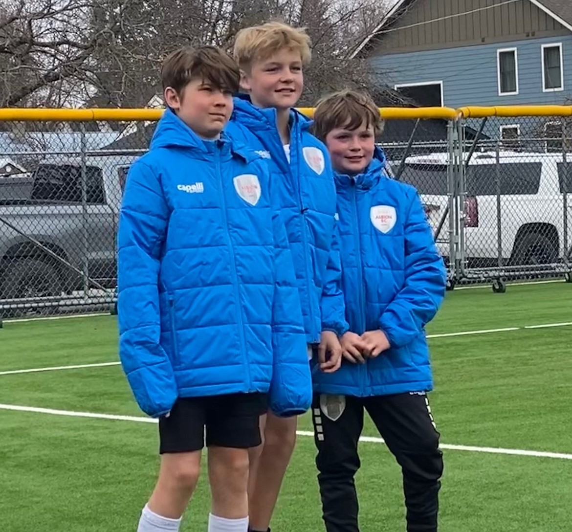 Full caption: During the 2024 ALBION SC Spring Break Soccer Camp at War Memorial Field, Felix Carlson (left), Marlon Rohm (middle), and Griffin Asquith (right) excelled with Albion’s challenging academy curriculum. The trio were declared the winners of the camp's three-day juggle competition. Even with the pressures of an audience and judges counting each touch, Asquith (nine years old), an Albion Idaho SC newcomer and standout goalkeeper, took third with 29 juggles. Rohm (12) of Sandpoint Strikers FC consistently tallied high scores all week, taking second with 39 juggles. Albion Idaho SC’s Felix Carlson (10) won the championship with 45 juggles in the final round. The three all won winter stadium jackets for their efforts, as seen in the photo.