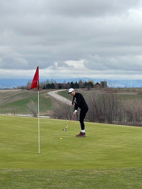 Thompson Falls freshman Aubrey Baxter puts toward the flag during the Florence-Darby Invitational tournament in Hamilton. (Photo courtesy of Doree Thilmony)