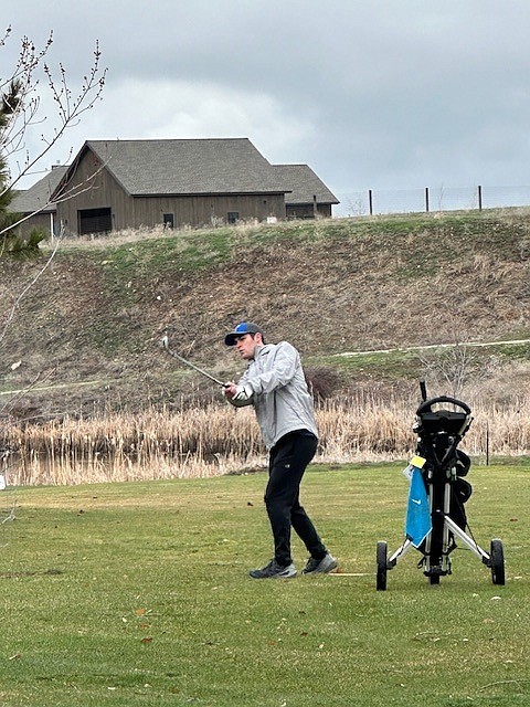 Thompson Falls golfer Braxton Dorscher strikes an iron shot during this past weekend's Florence-Darby Invitational in Hamilton.  (Photo courtesy of Doree Thilmony)