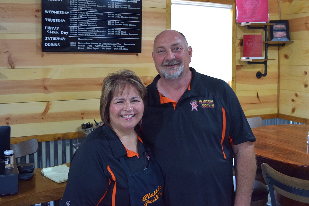 Birdie Fought, left, and her husband Tim Fought, right, stand inside their newly opened Classic Grill’n barbecue café in Othello, which had been in the works for more than a year before opening in early March.