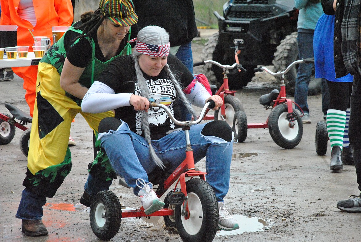 Sam Easter pushes teammate Hazel Roper to get moving on team Rolling Stoned. (Mineral Independent/Amy Quinlivan)