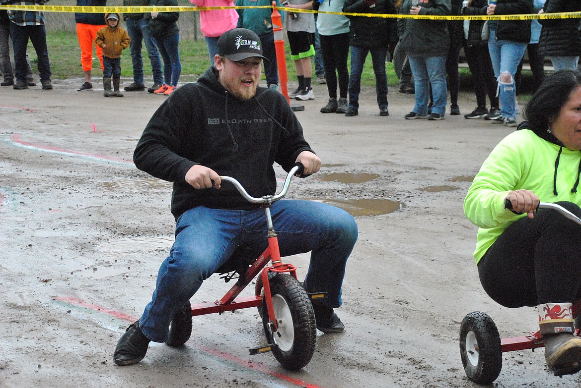 Like most men competing, Luke Boyce, from Superior learns the hard way that long legs and little tricycles don't mix. (Mineral Independent/Amy Quinlivan)