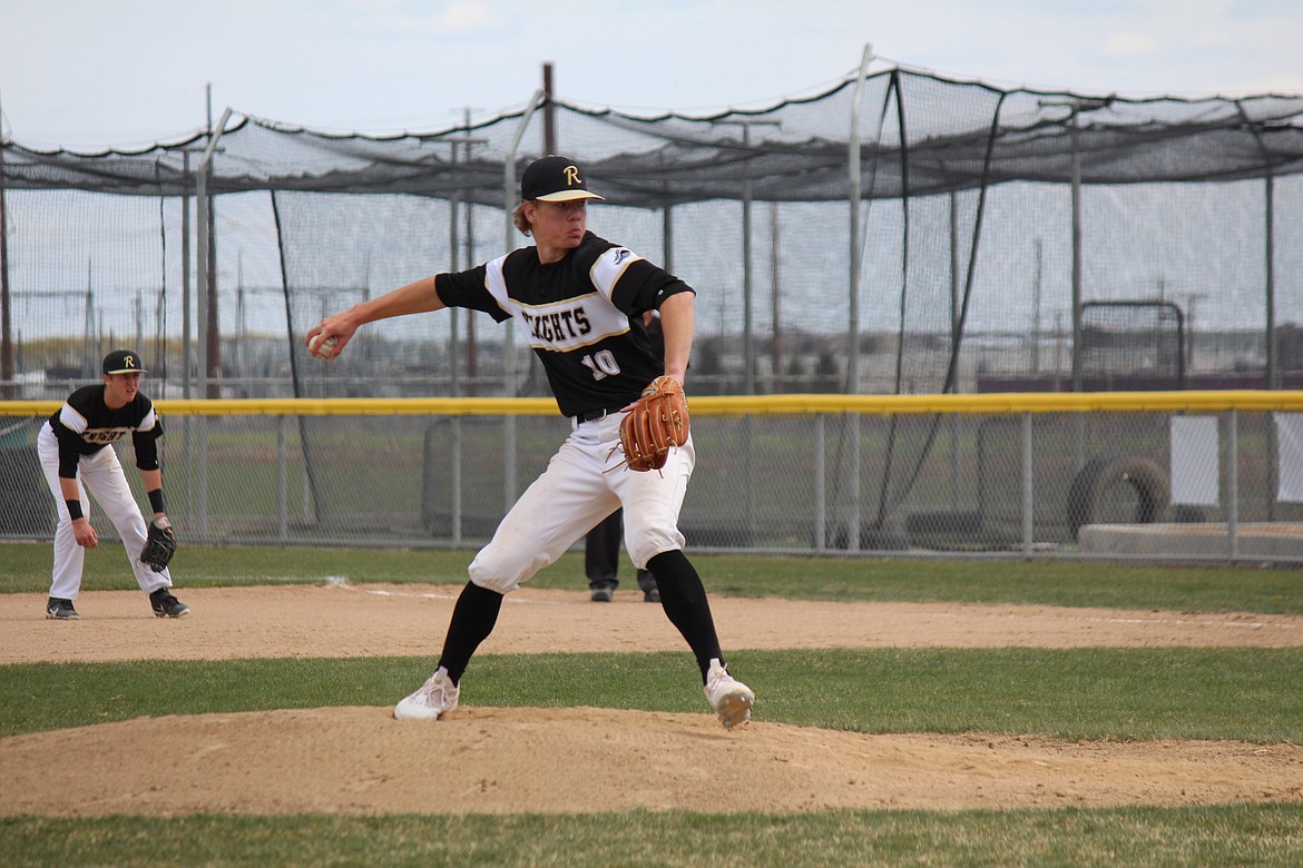 Royal’s Ben Jenks (10) delivers the pitch in a game against Quincy Saturday. Jenks only gave up one hit.