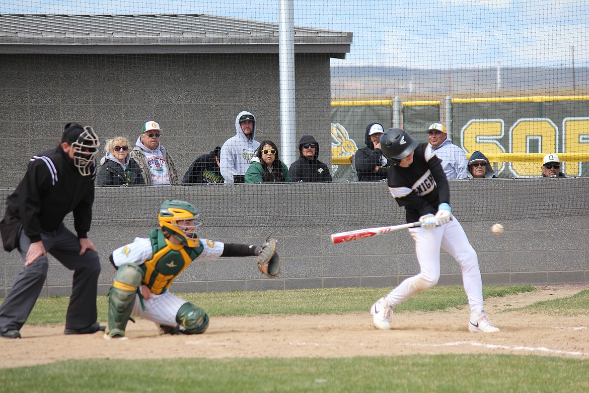 The pitch comes in and a Royal hitter starts to swing in Saturday’s Quincy-Royal doubleheader.