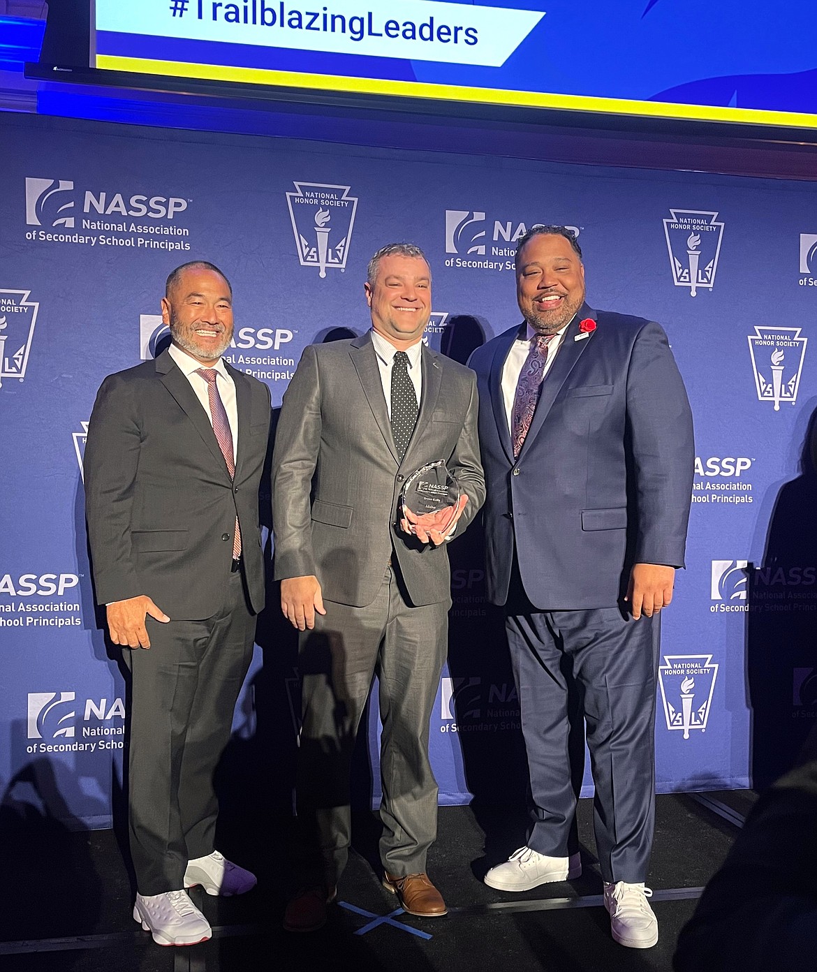 Lake City High School Assistant Principal Bryan Kelly, center, is honored during an award ceremony in Washington, D.C. for being named Idaho's 2024 Vice Principal of the Year. Also pictured: Ronn Nozoe, chief executive officer of the National Association of Secondary School Principals, left; and Aaron Huff, president of the National Association of Secondary School Principals board.