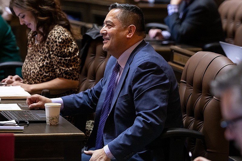 Rep. Alex Ybarra, R-Quincy, sits in the Washington State Capitol building in Olympia and participates in discussion during the 2024 legislative session.