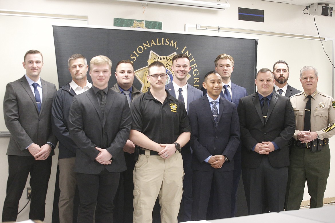 Back row: Jake Best, Donald Wagner, Robert Cranfill, Tyler Rogge, Kasey Kelly, Rian McNamara. Front row: Kyle Hunzker, Jacob Carter, Matt Swan, Noah Kline, Kootenai County Sheriff Bob Norris.