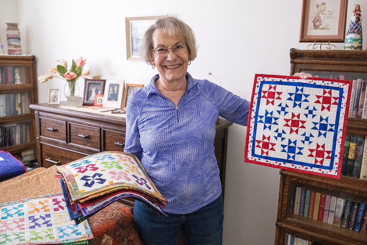 Barbara Taylor shows off her Fourth of July monthly mini quilt.