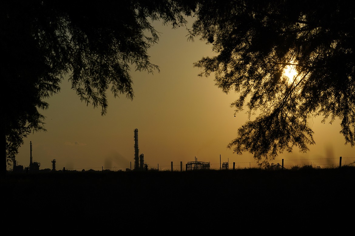 The Denka Performance Elastomer Plant sits at sunset in Reserve, La., on Sept. 23, 2022. The Environmental Protection Agency on Tuesday, April 9, 2024, issued a rule that will force more than 200 chemical plants nationwide to reduce toxic compounds that cross beyond their property lines, exposing thousands of people to elevated cancer risks. The rule will significantly reduce harmful emissions at the Denka Performance Elastomer facility, the largest source of chloroprene emissions in the country, EPA Administrator Michael Regan said. (AP Photo/Gerald Herbert, File)