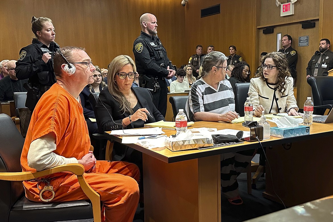 From left, James Crumbley, defense lawyer Mariell Lehman, Jennifer Crumbley, and defense lawyer Shannon Smith await sentencing in Oakland County, Mich., court on Tuesday, April 9, 2024. The Crumbleys were convicted of involuntary manslaughter for a school shooting committed by their son in 2021. (AP Photo/Ed White)